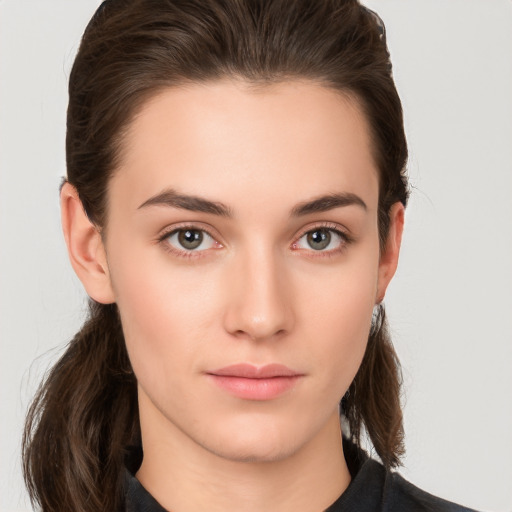 Neutral white young-adult female with medium  brown hair and brown eyes