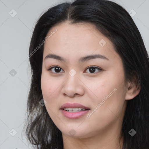 Joyful asian young-adult female with long  brown hair and brown eyes