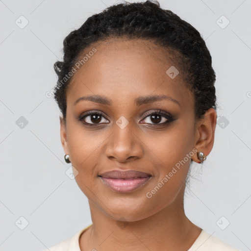 Joyful black young-adult female with short  black hair and brown eyes