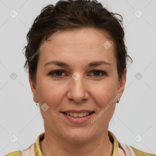 Joyful white adult female with short  brown hair and grey eyes