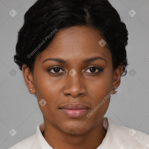 Joyful black young-adult female with short  black hair and brown eyes