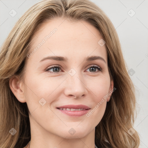 Joyful white young-adult female with long  brown hair and blue eyes