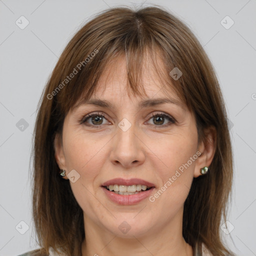 Joyful white adult female with medium  brown hair and grey eyes