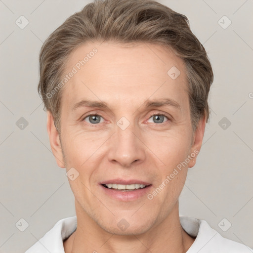 Joyful white adult male with short  brown hair and grey eyes