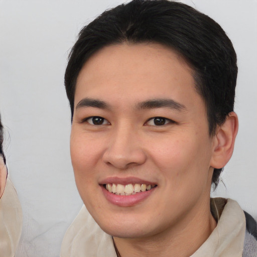 Joyful white young-adult male with medium  brown hair and brown eyes