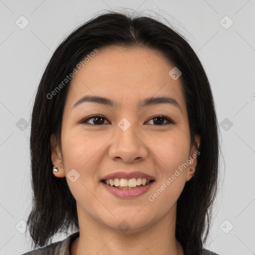 Joyful latino young-adult female with medium  brown hair and brown eyes