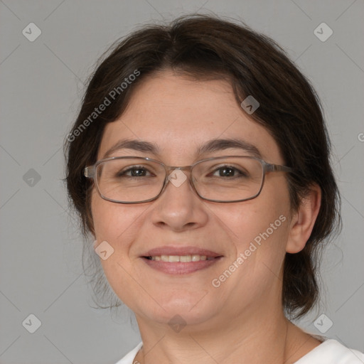 Joyful white adult female with medium  brown hair and brown eyes