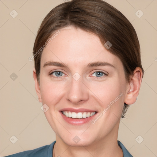 Joyful white young-adult female with short  brown hair and grey eyes