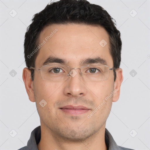 Joyful white young-adult male with short  black hair and brown eyes