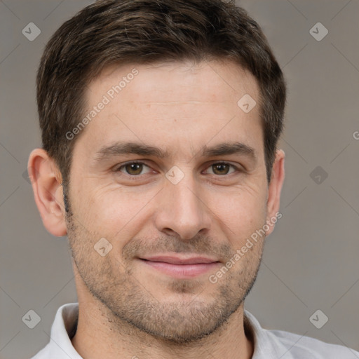 Joyful white adult male with short  brown hair and brown eyes