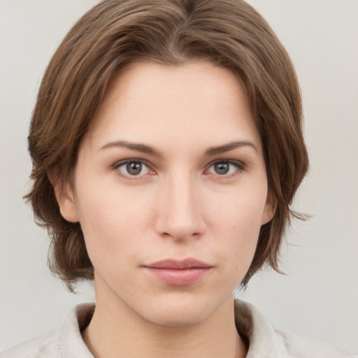 Neutral white young-adult female with medium  brown hair and grey eyes