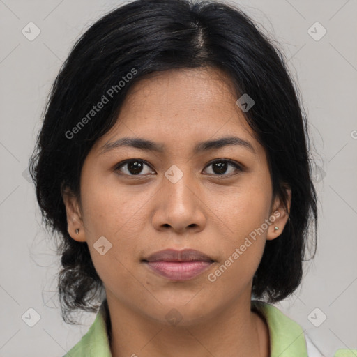 Joyful asian young-adult female with medium  brown hair and brown eyes