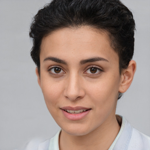 Joyful white young-adult female with short  brown hair and brown eyes