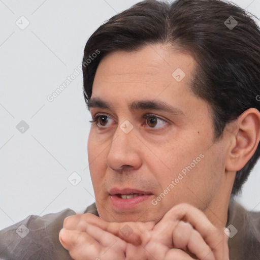 Joyful white adult male with short  brown hair and brown eyes