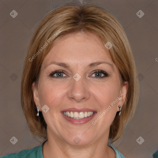 Joyful white adult female with medium  brown hair and blue eyes