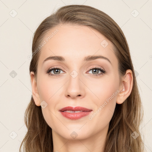 Joyful white young-adult female with long  brown hair and blue eyes