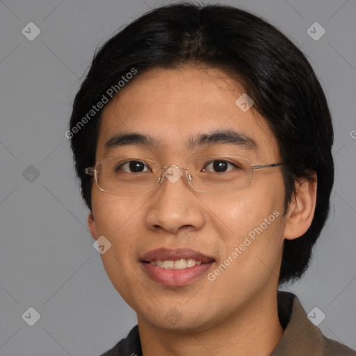 Joyful asian young-adult male with short  brown hair and brown eyes