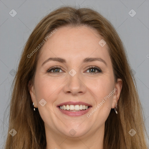 Joyful white adult female with long  brown hair and grey eyes