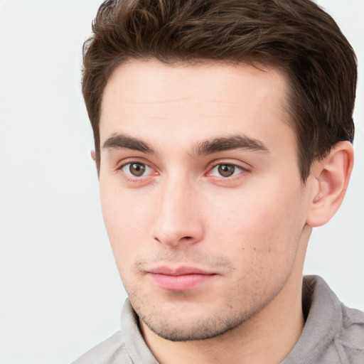 Neutral white young-adult male with short  brown hair and brown eyes