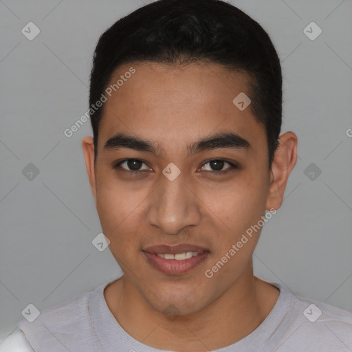 Joyful latino young-adult male with short  black hair and brown eyes