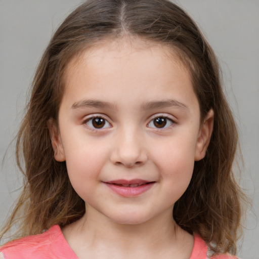 Joyful white child female with medium  brown hair and brown eyes