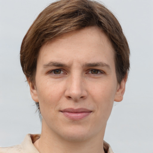 Joyful white young-adult female with short  brown hair and grey eyes