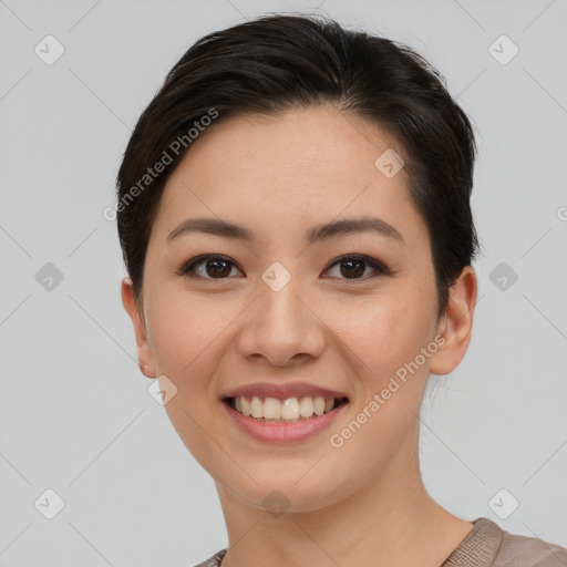 Joyful asian young-adult female with short  brown hair and brown eyes