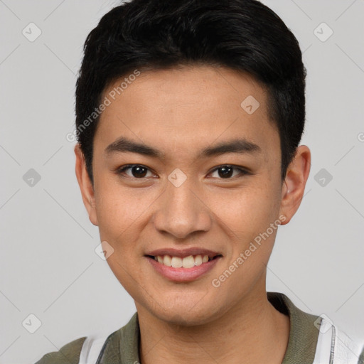 Joyful asian young-adult male with short  black hair and brown eyes