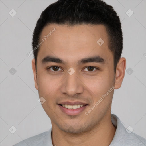 Joyful white young-adult male with short  black hair and brown eyes