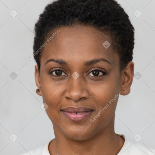 Joyful black young-adult female with short  black hair and brown eyes