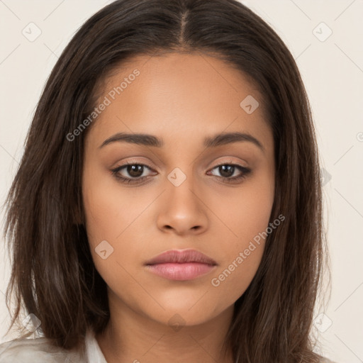 Neutral white young-adult female with long  brown hair and brown eyes