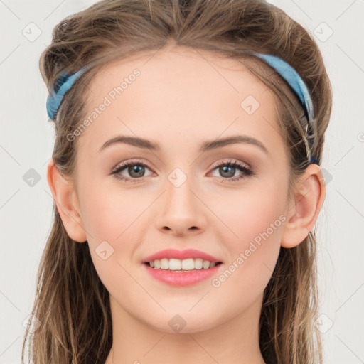 Joyful white young-adult female with long  brown hair and grey eyes