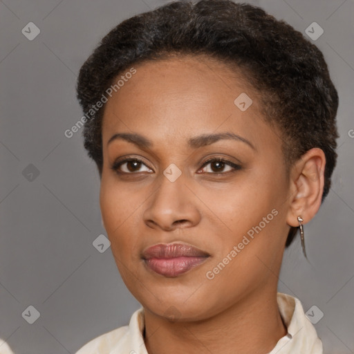 Joyful black young-adult female with short  brown hair and brown eyes