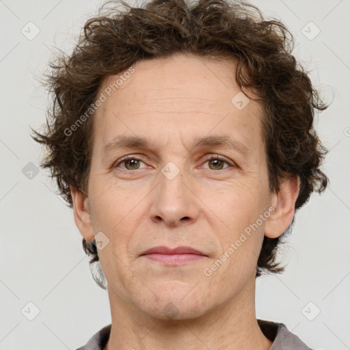 Joyful white adult male with short  brown hair and grey eyes