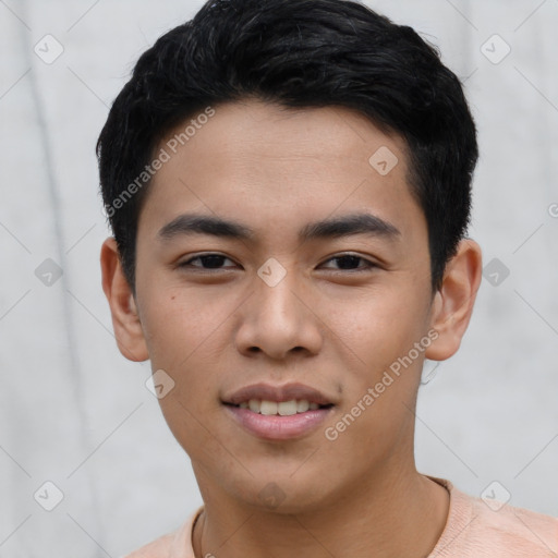 Joyful asian young-adult male with short  black hair and brown eyes