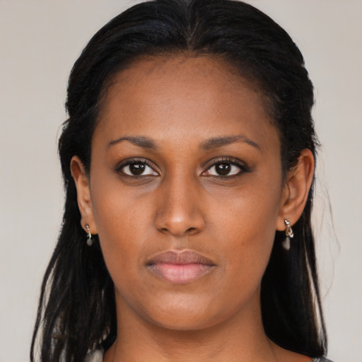 Neutral black young-adult female with long  brown hair and brown eyes