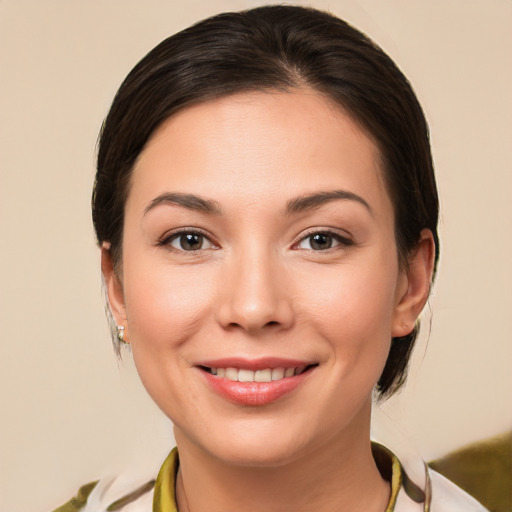 Joyful white young-adult female with medium  brown hair and brown eyes