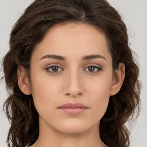 Neutral white young-adult female with long  brown hair and brown eyes