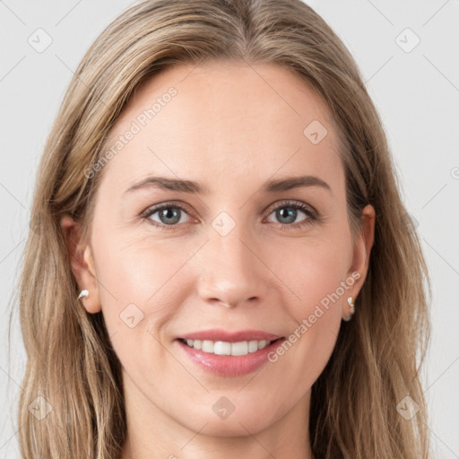 Joyful white young-adult female with long  brown hair and grey eyes