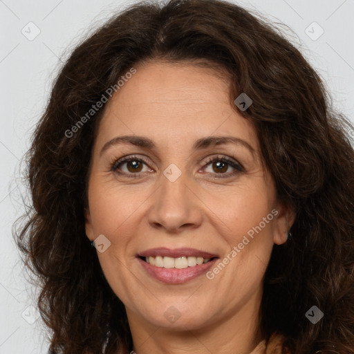 Joyful white adult female with long  brown hair and brown eyes