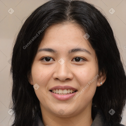 Joyful asian young-adult female with long  brown hair and brown eyes