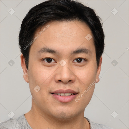 Joyful asian young-adult male with short  brown hair and brown eyes