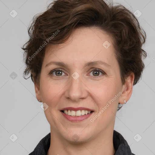 Joyful white adult female with short  brown hair and grey eyes