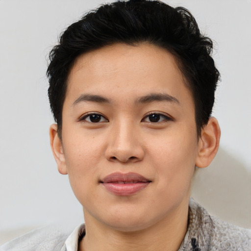 Joyful asian young-adult female with short  brown hair and brown eyes