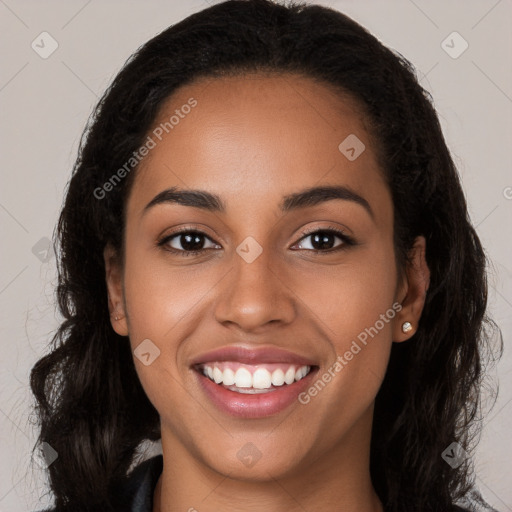 Joyful latino young-adult female with long  brown hair and brown eyes