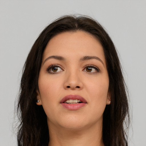 Joyful white young-adult female with long  brown hair and brown eyes