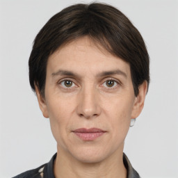 Joyful white adult female with short  brown hair and brown eyes