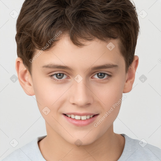 Joyful white child male with short  brown hair and brown eyes