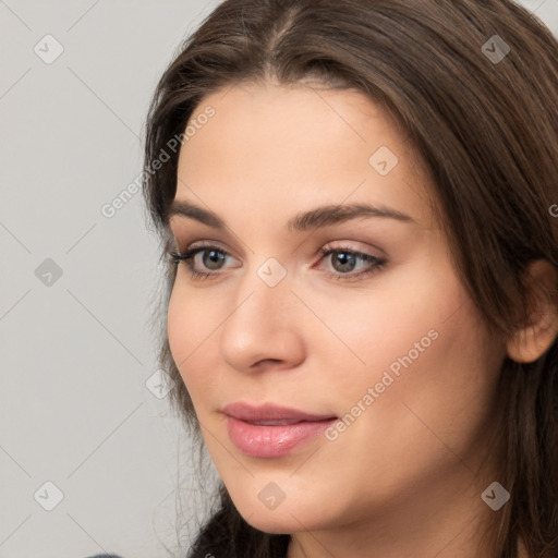 Neutral white young-adult female with long  brown hair and brown eyes