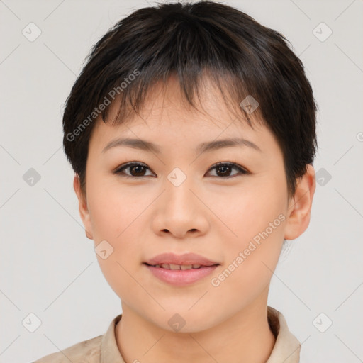 Joyful asian young-adult female with short  brown hair and brown eyes